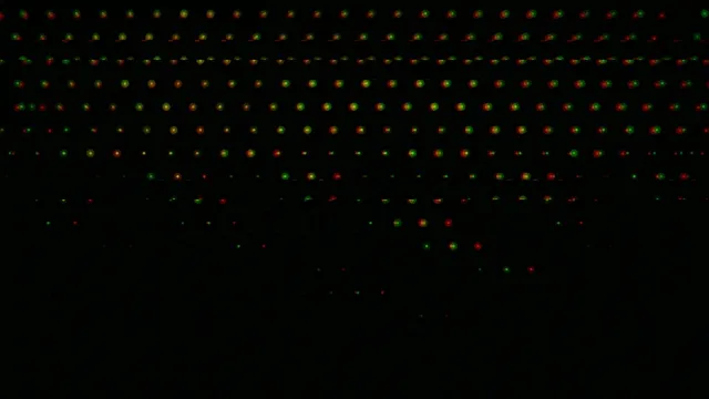 4K animated falling particles loop with dynamic color gradient