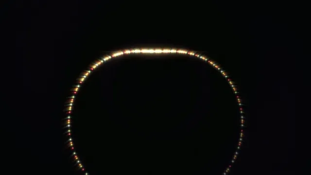 4K glowing neon circle loop with colorful LED lights on black