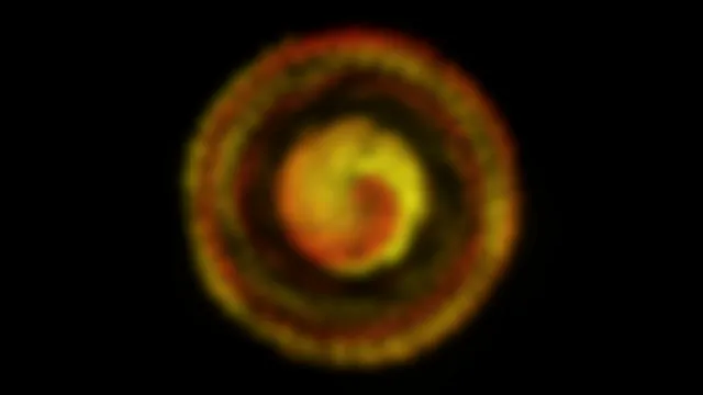 Abstract 4K rotating vortex motion background with warm color gradients