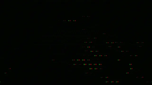 Abstract 4K UHD particle motion background with neon green and red dots