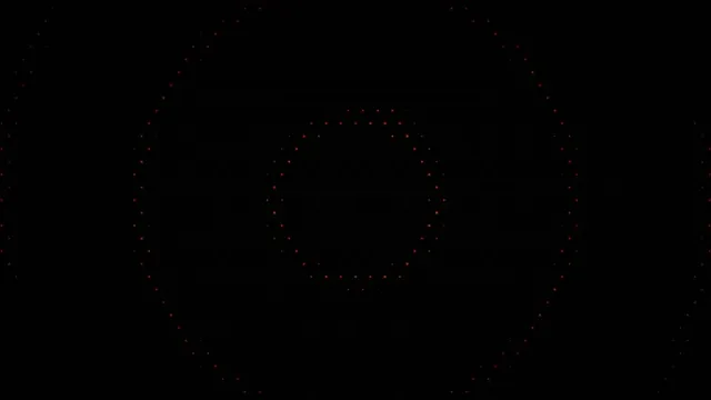Abstract Orange Particles Forming Circle on Black 4K