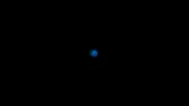 Blue Glowing Orb on Black Background 4K