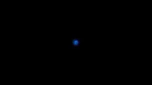 Blue Glowing Orb on Black Background - Abstract Light