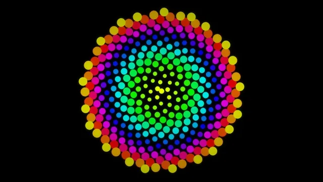 Colorful design of circles in swirling pattern on black background