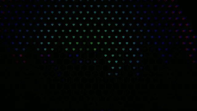Colorful heart patterns display in a dark setting at night
