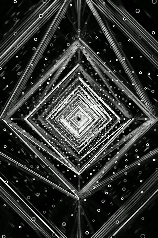 Μαύρο και λευκό νέον τούνελ με συγκεντρικά διαμαντένια σχήματα, ακτινωτές φωτεινές ακτίνες και διασκορπισμένοι λευκοί κύκλοι που δημιουργούν υπνωτικό δίνη VJ loop