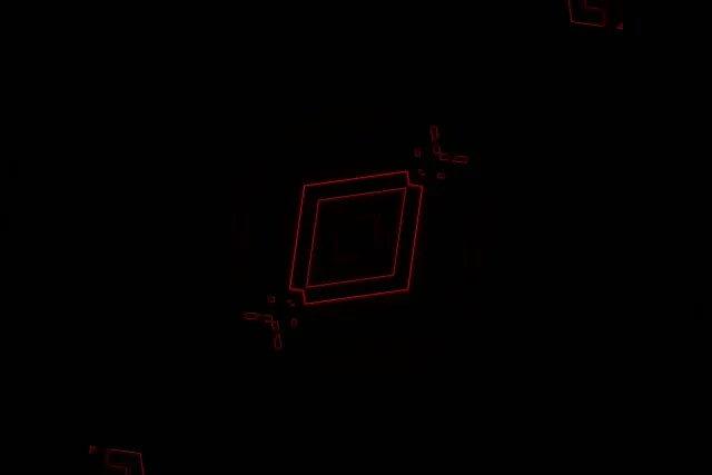 Nyekundu neon tunnel na ina diamond-shaped vortex katika 4K VJ loop, maumbo geometriki unaomwangaza unazunguka ndani ya giza katika 60fps