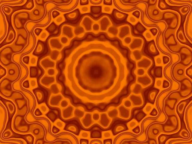 Koncentriski oranži neonā apļi spirāļveida iet caur simetrisku mandala rakstu, veidojot burvīgu VJ cilpu ar silti zeltaini toņiem