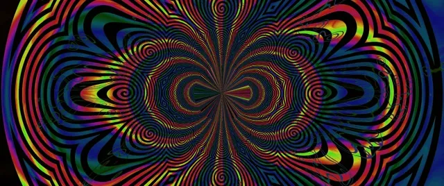 Kaleidoskop spiral neon yang vibrant dengan lingkaran konsentris merah muda, kuning dan biru dalam gerakan VJ loop simetris
