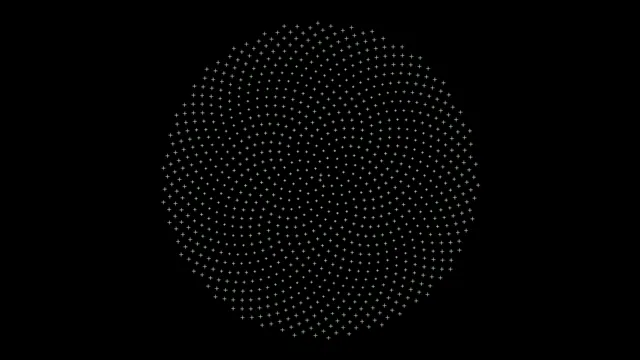 Pattern of dots forms a circular design on a black background