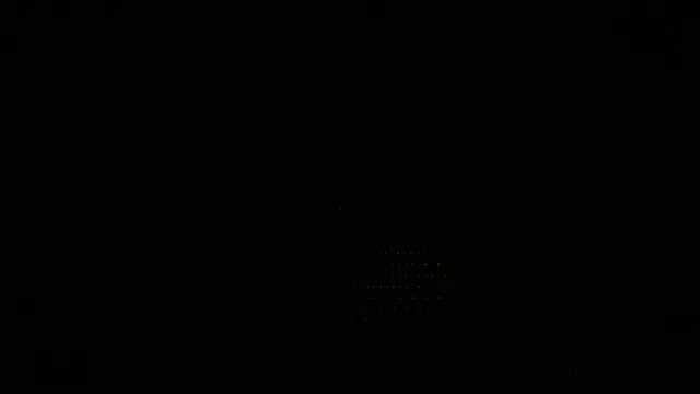 Red Digital Particles Dispersing on Black Background