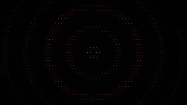 Red Heart Particles Forming Circle on Black Background