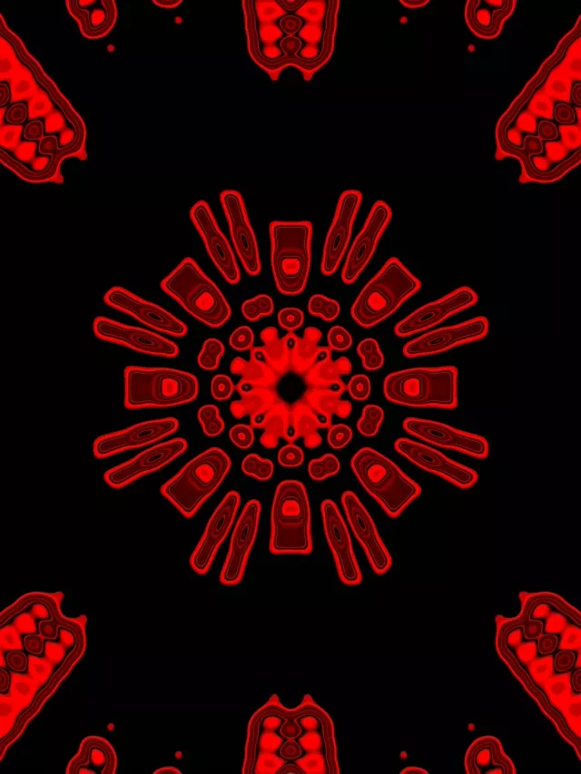 Promieniujący czerwony wzór kaleidoskopu neonowego z symetrycznymi kształtami geometrycznymi promieniującymi od środka, tworzący hipnotyzujący efekt tunelu - pętla VJ